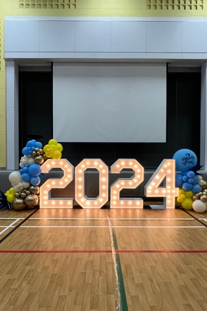 2024 Marquee Lights with Two Blue Gold White Yellow Balloon Garlands on Each Side | Majestic Balloons | Cambridge, Ontario