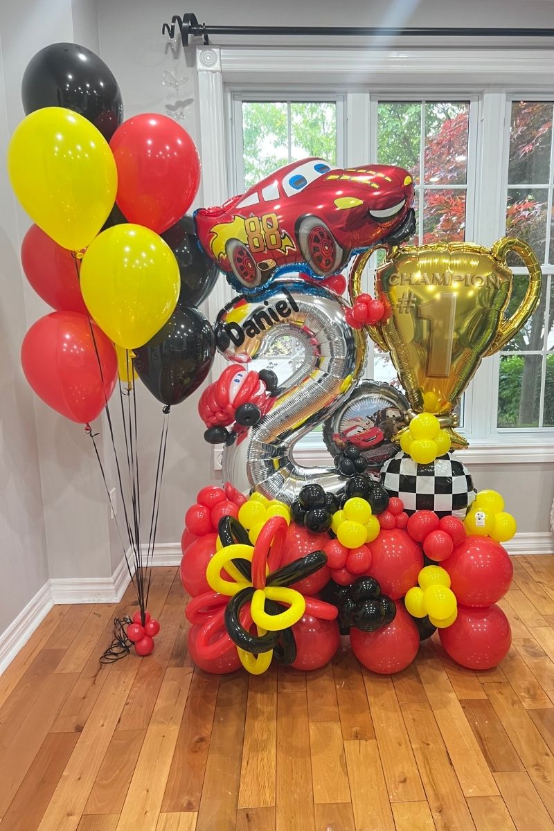 Cars Themed Balloon Display Red Yellow Black with a Trophy | Majestic Balloons | Cambridge, Ontario